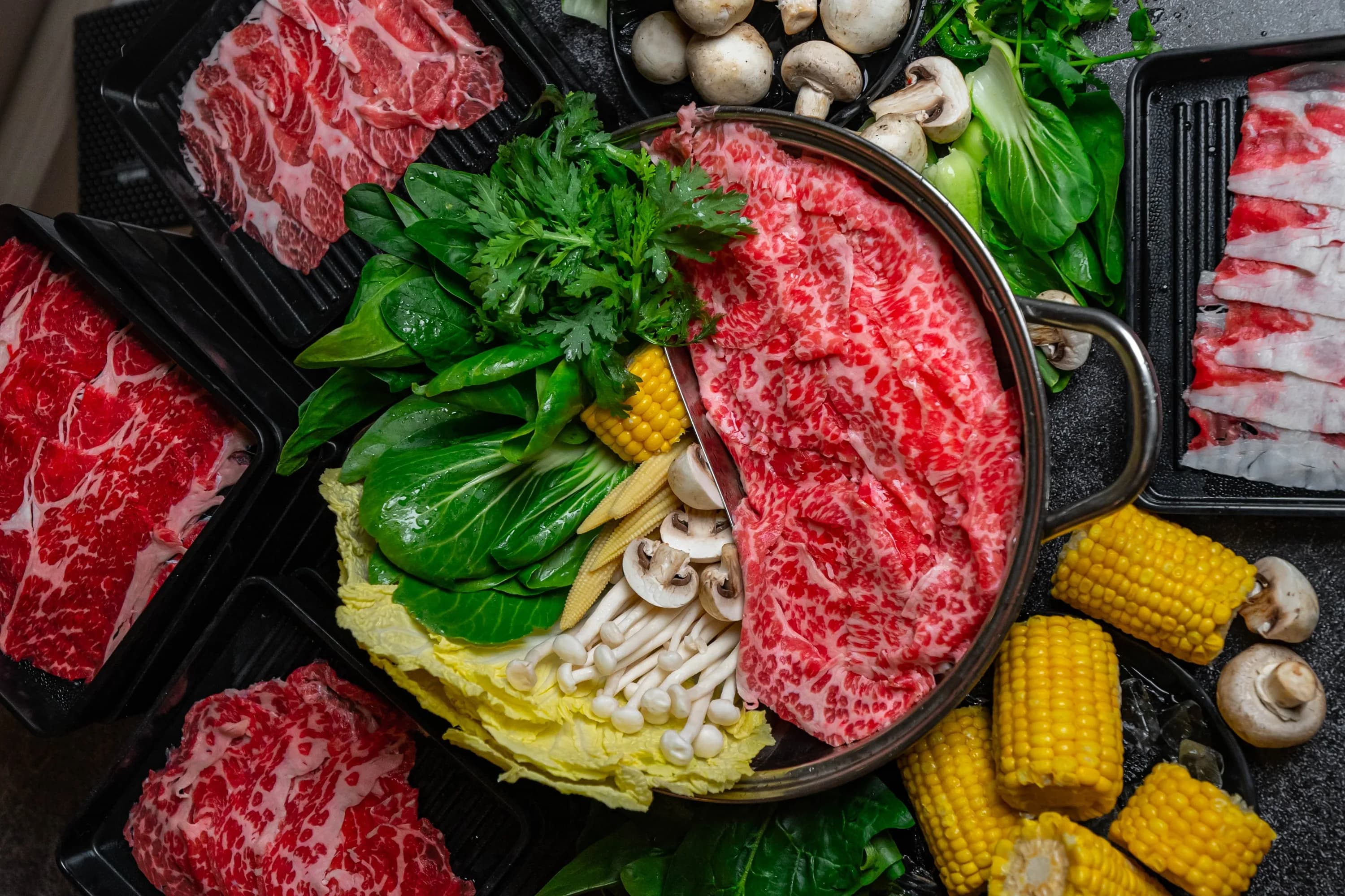 Premium wagyu spread with broth and fresh vegetables