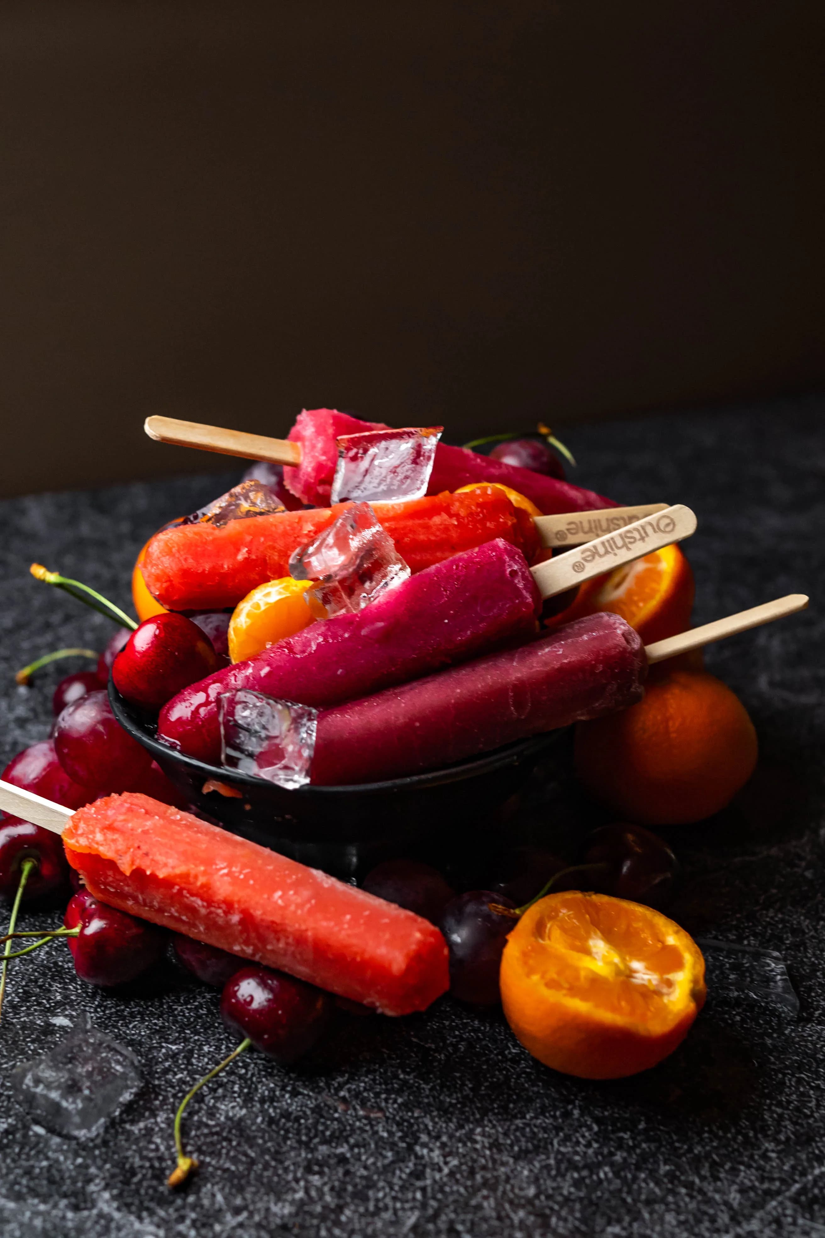 Colorful fruit popsicles and ice cream